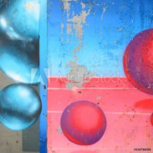 Bild på Fragment of graffiti drawings The old wall decorated with paint stains in the style of street art culture Colored background texture in cold tones